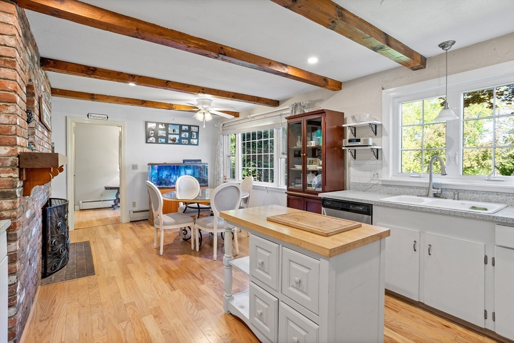 717 George Hill Road Lancaster, MA 01523 - Photo 19 of 36 a living room with stainless steel appliances kitchen island granite countertop a stove and a sink