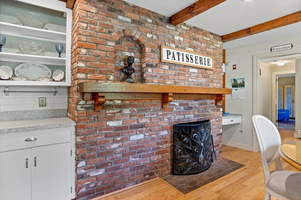 717 George Hill Road Lancaster, MA 01523 - Photo 21 of 36 a dining room with fireplace