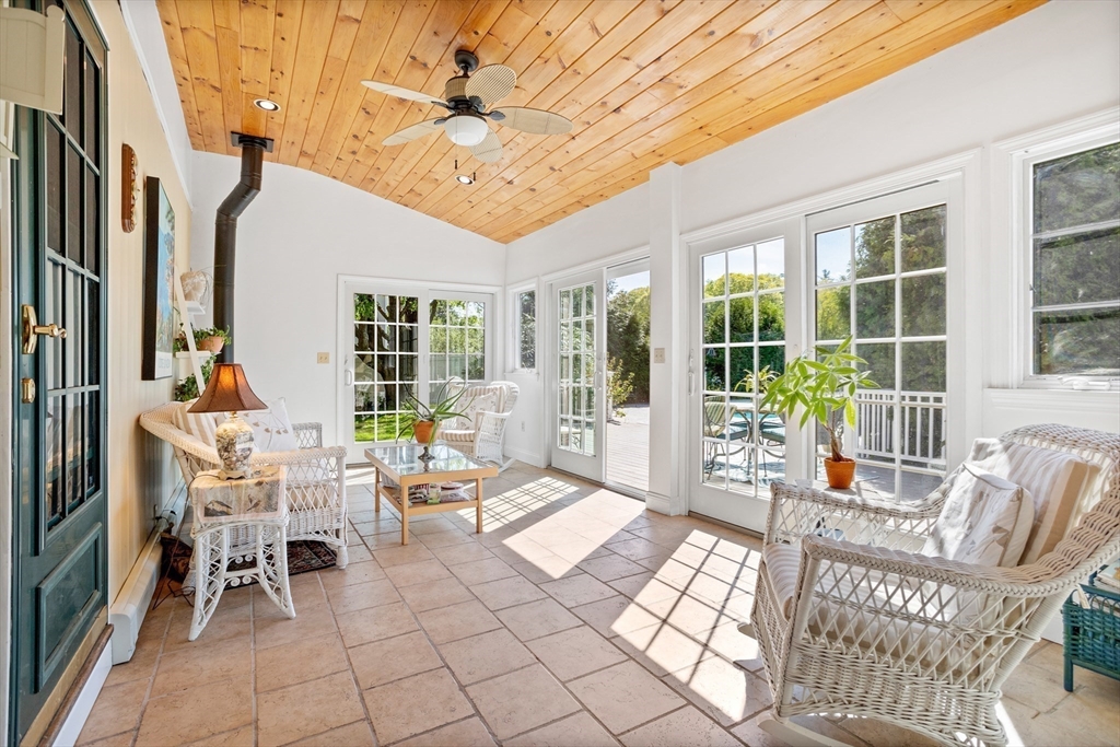 717 George Hill Road Lancaster, MA 01523 - Photo 23 of 36 a outdoor space with lots of chairs and a chandelier