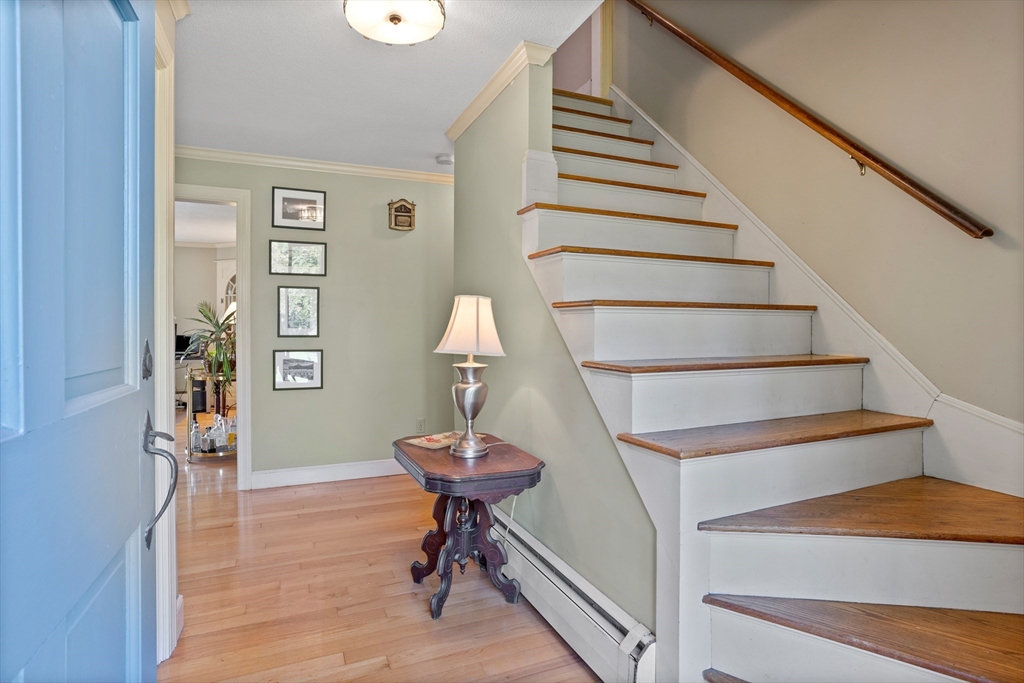 717 George Hill Road Lancaster, MA 01523 - Photo 27 of 36 a view of entryway and hall with wooden floor