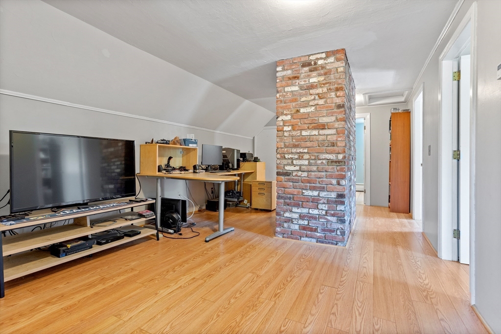 717 George Hill Road Lancaster, MA 01523 - Photo 28 of 36 a view of a livingroom with furniture and a flat screen tv
