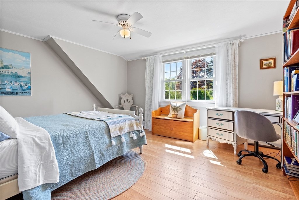 717 George Hill Road Lancaster, MA 01523 - Photo 30 of 36 a bedroom with a bed and wooden floor