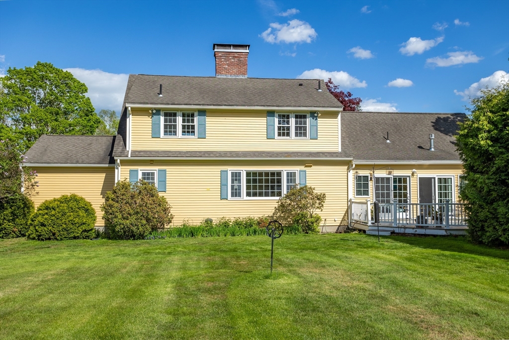 717 George Hill Road Lancaster, MA 01523 - Photo 3 of 36 a front view of a house with garden
