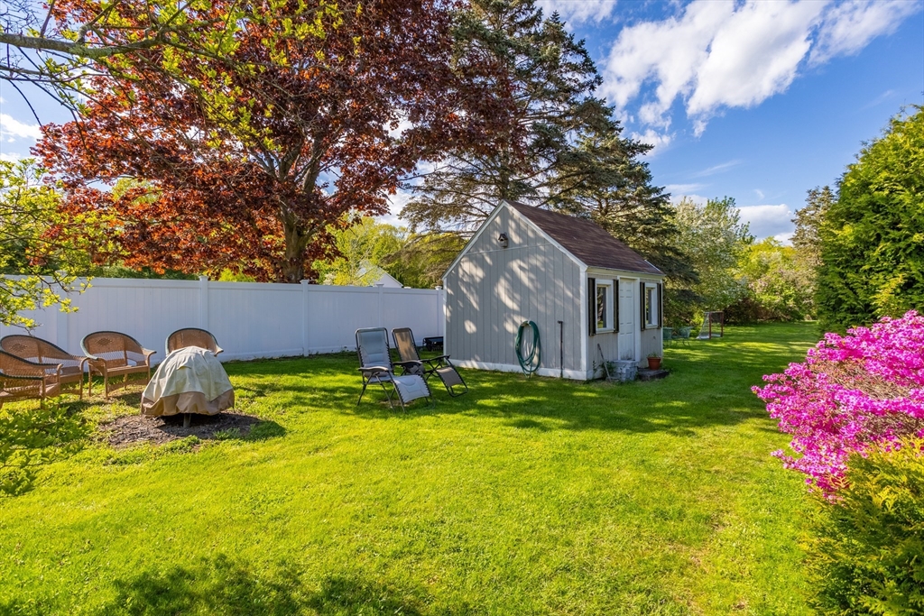 717 George Hill Road Lancaster, MA 01523 - Photo 4 of 36 a house view with a sitting space and garden