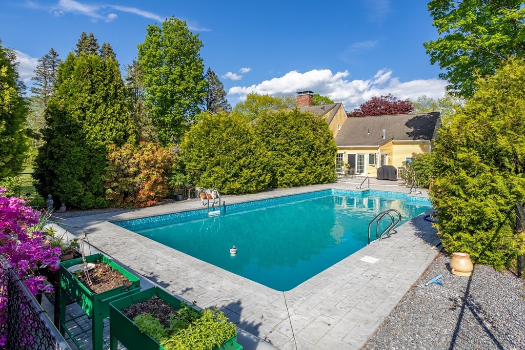 717 George Hill Road Lancaster, MA 01523 - Photo 6 of 36 a view of a house with a garden