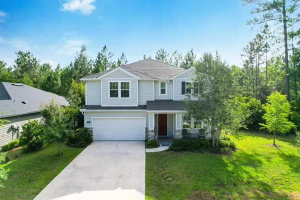 a view of livingroom with chandelier and wooden floor
