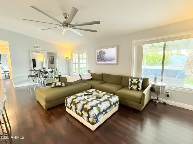 a living room with furniture and a large window