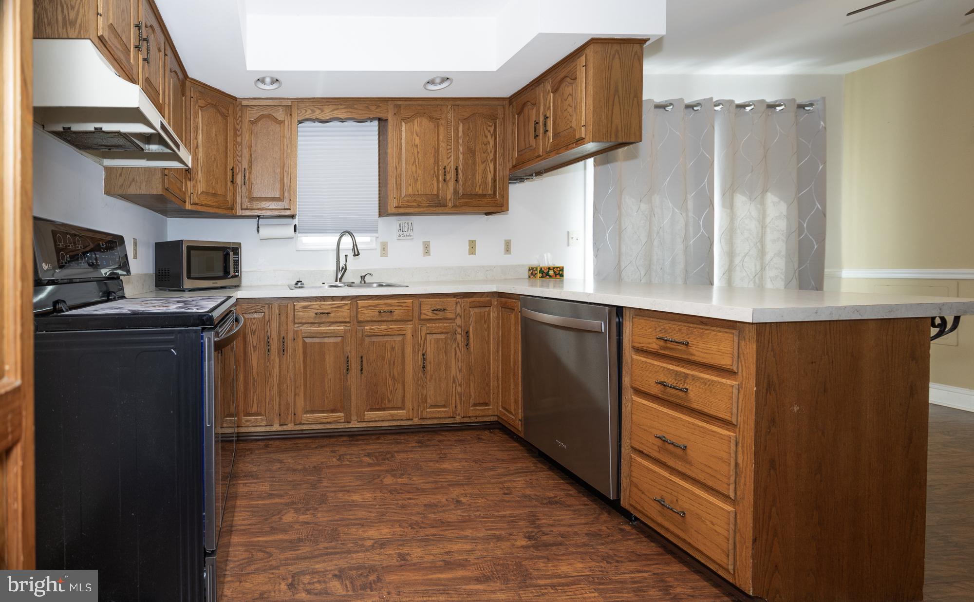 10958 Pit Road Seaford, DE 19973 - Photo 18 of 56 Warm wood tones in a spacious kitchen.