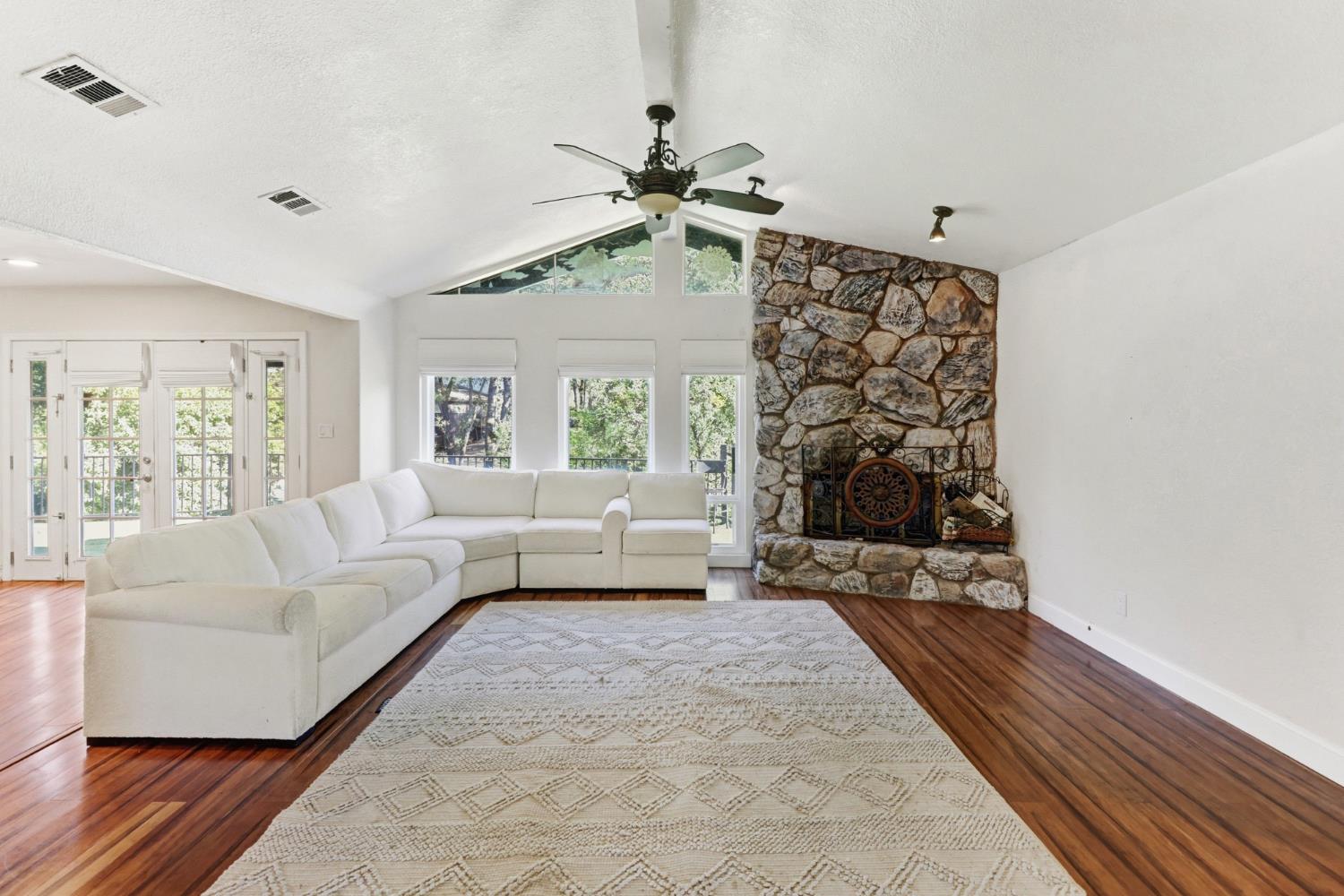 4330 Cavitt Stallman Road Granite Bay, CA 95746 - Photo 14 of 85 a living room with furniture and a fireplace