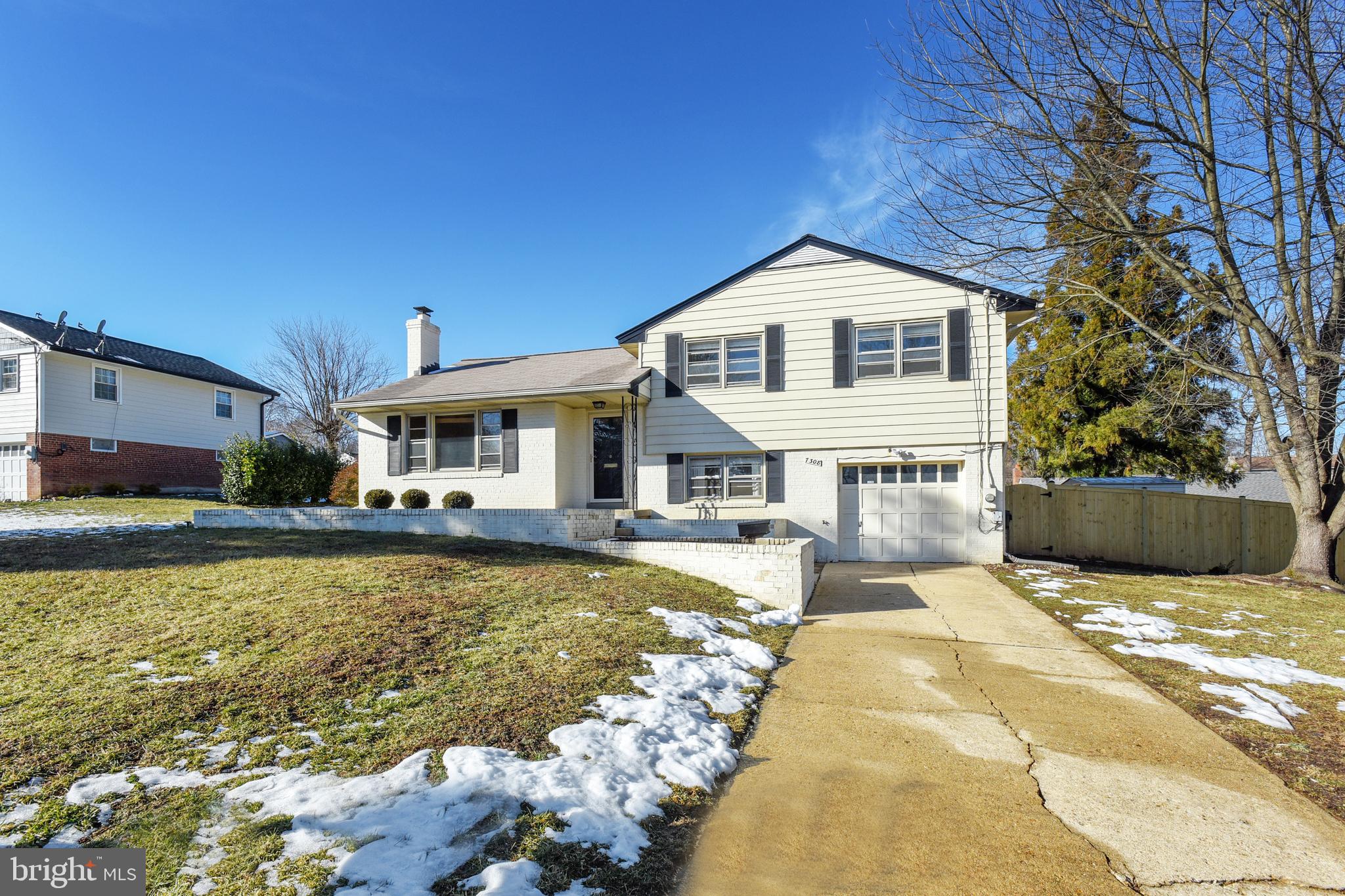 7308 Foxe Place Springfield, VA 22151 - Photo 2 of 38 a front view of a house with swimming pool