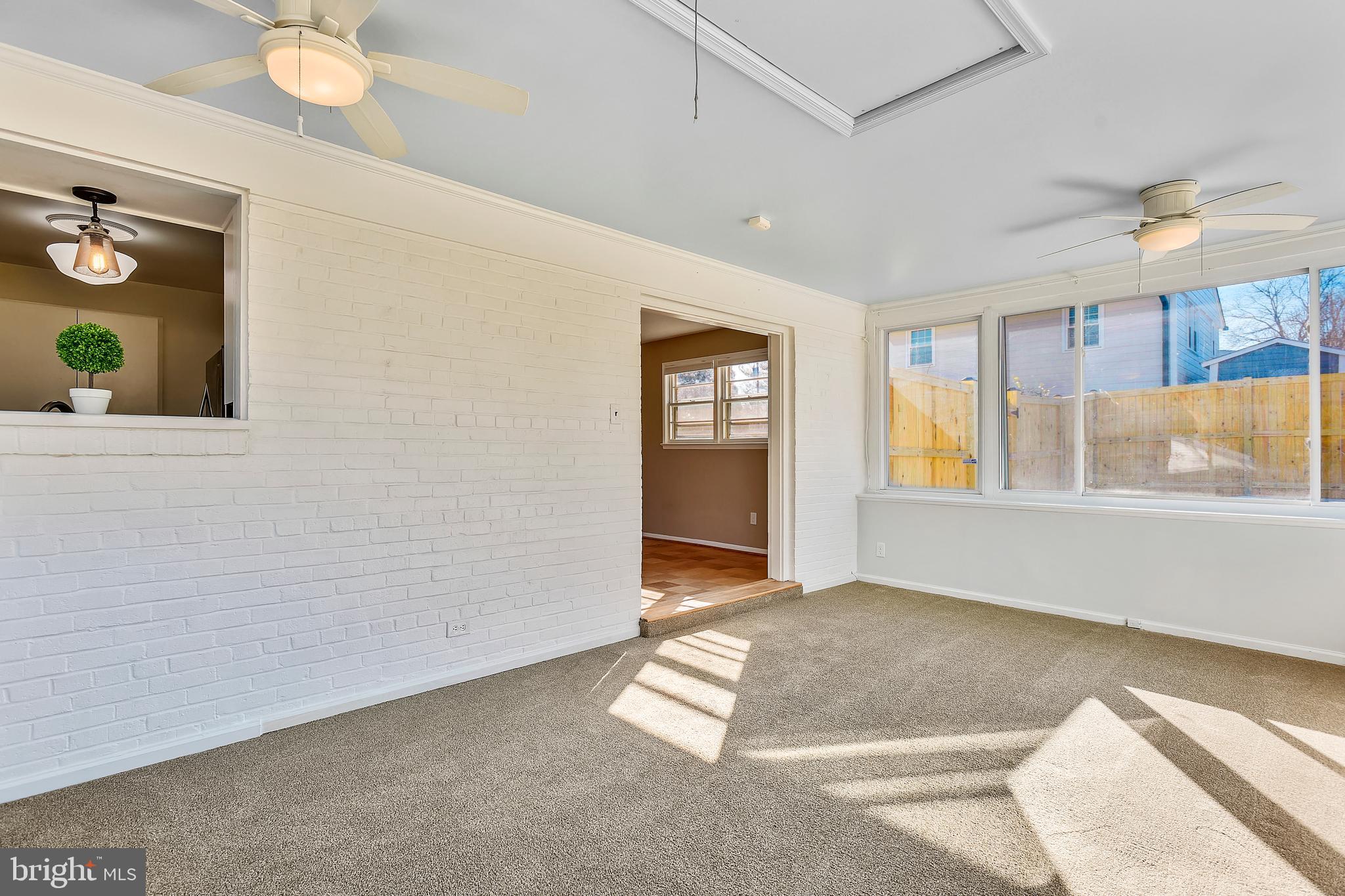 7308 Foxe Place Springfield, VA 22151 - Photo 13 of 38 a view of an empty room with window and wooden floor