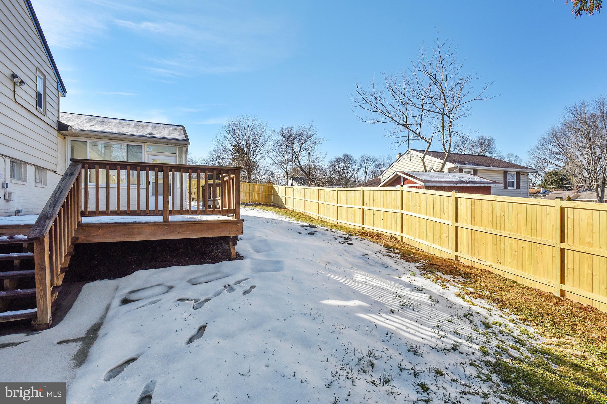 7308 Foxe Place Springfield, VA 22151 - Photo 17 of 38 a view of a yard with wooden fence