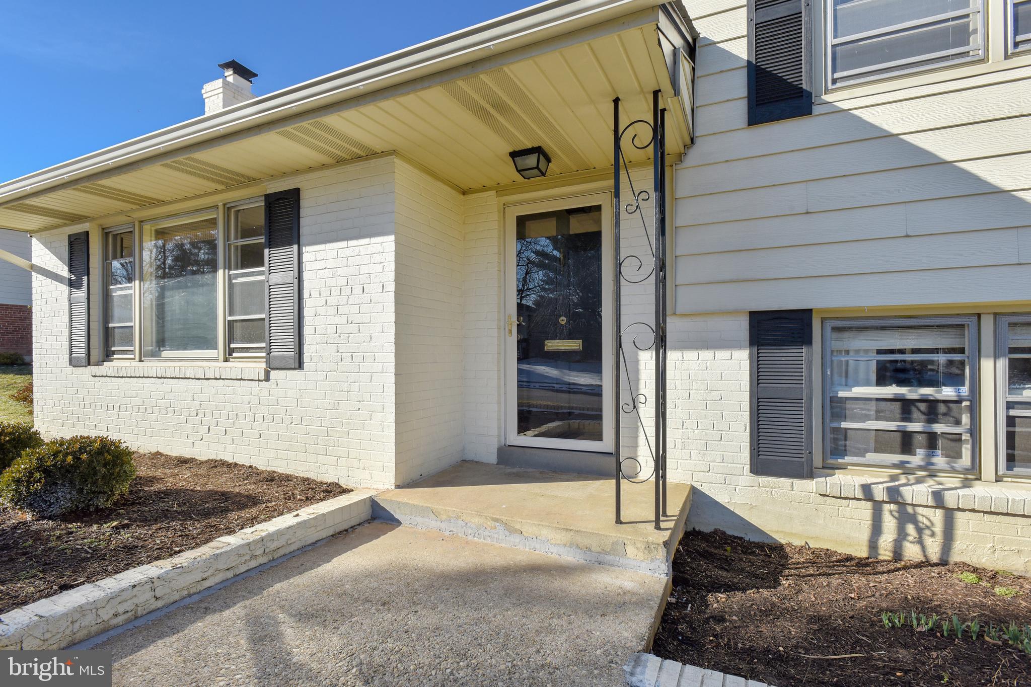 7308 Foxe Place Springfield, VA 22151 - Photo 3 of 38 a front view of a house with patio