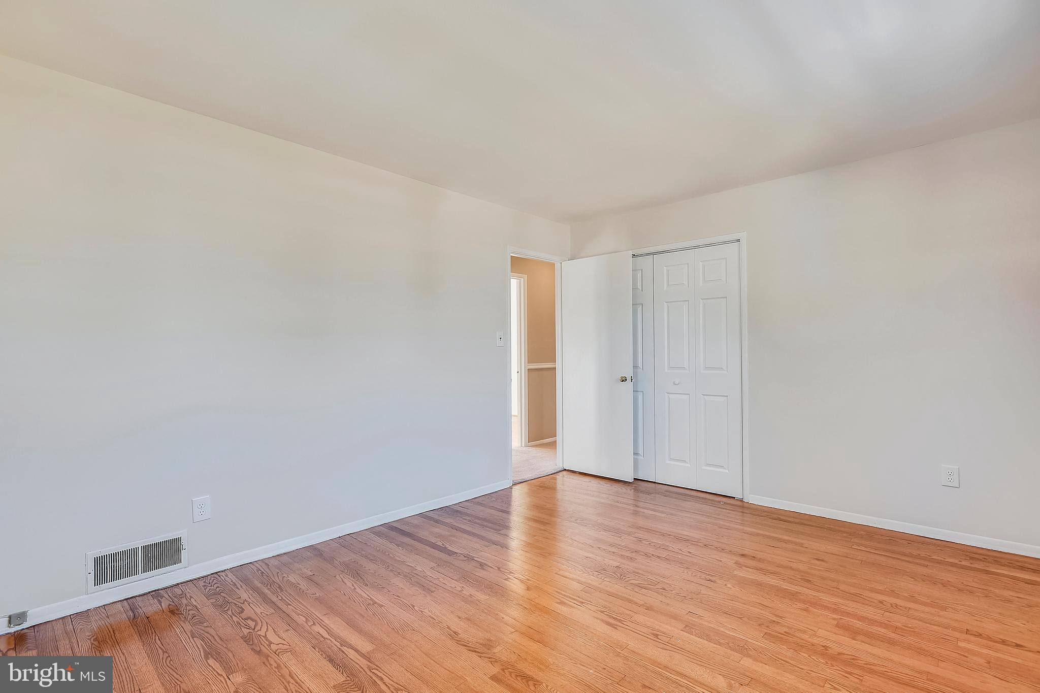 7308 Foxe Place Springfield, VA 22151 - Photo 22 of 38 a view of an empty room with wooden floor