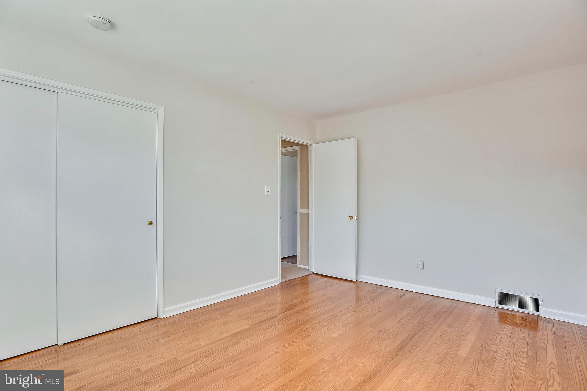 7308 Foxe Place Springfield, VA 22151 - Photo 25 of 38 a view of an empty room with wooden floor
