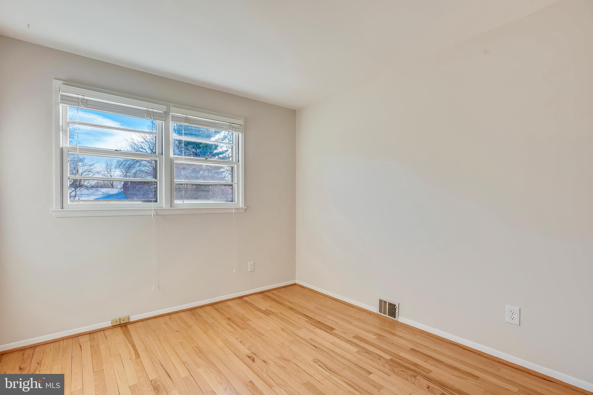 7308 Foxe Place Springfield, VA 22151 - Photo 26 of 38 a view of empty room with wooden floor and fan