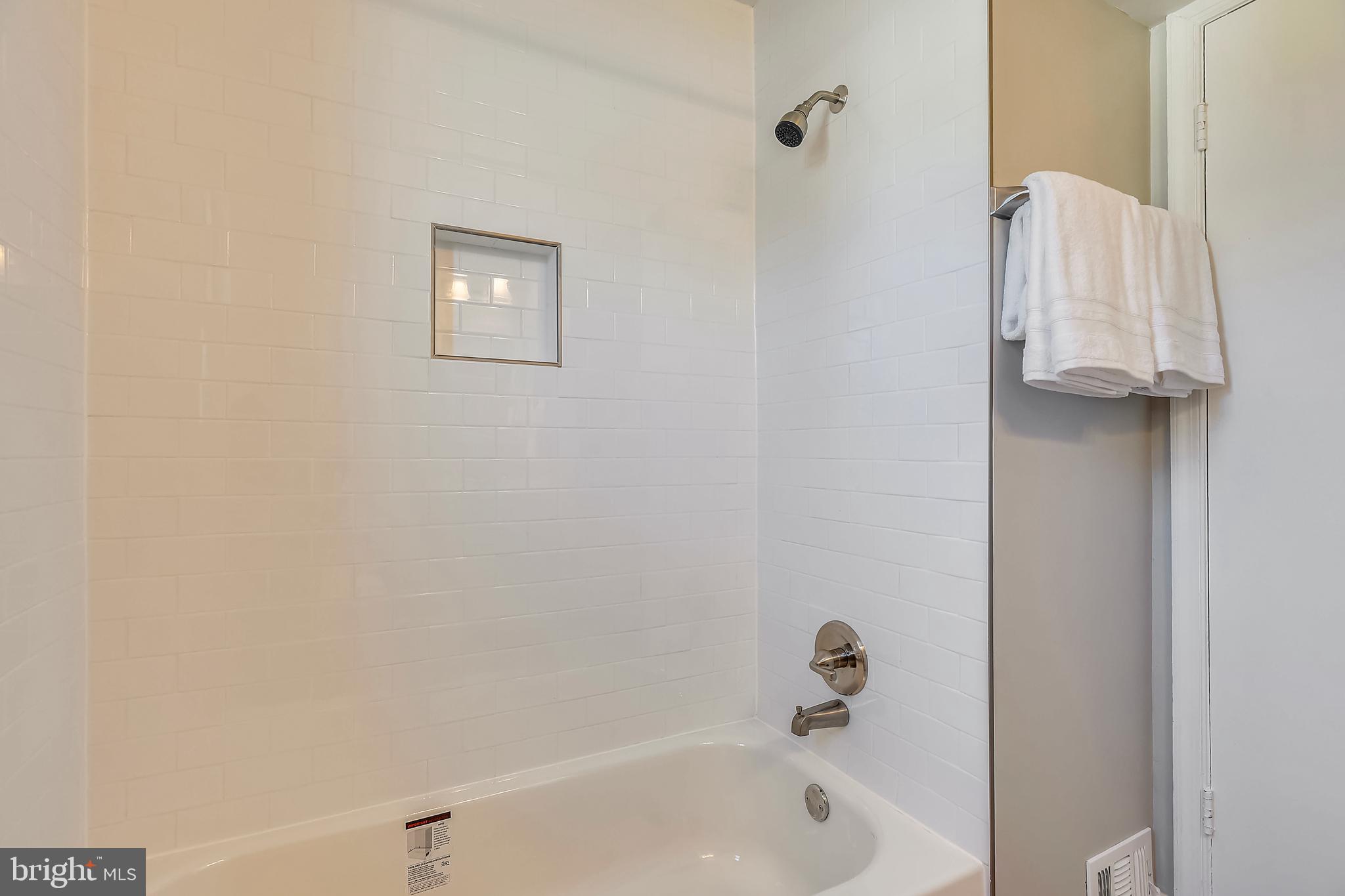 7308 Foxe Place Springfield, VA 22151 - Photo 29 of 38 a bathroom with a bathtub