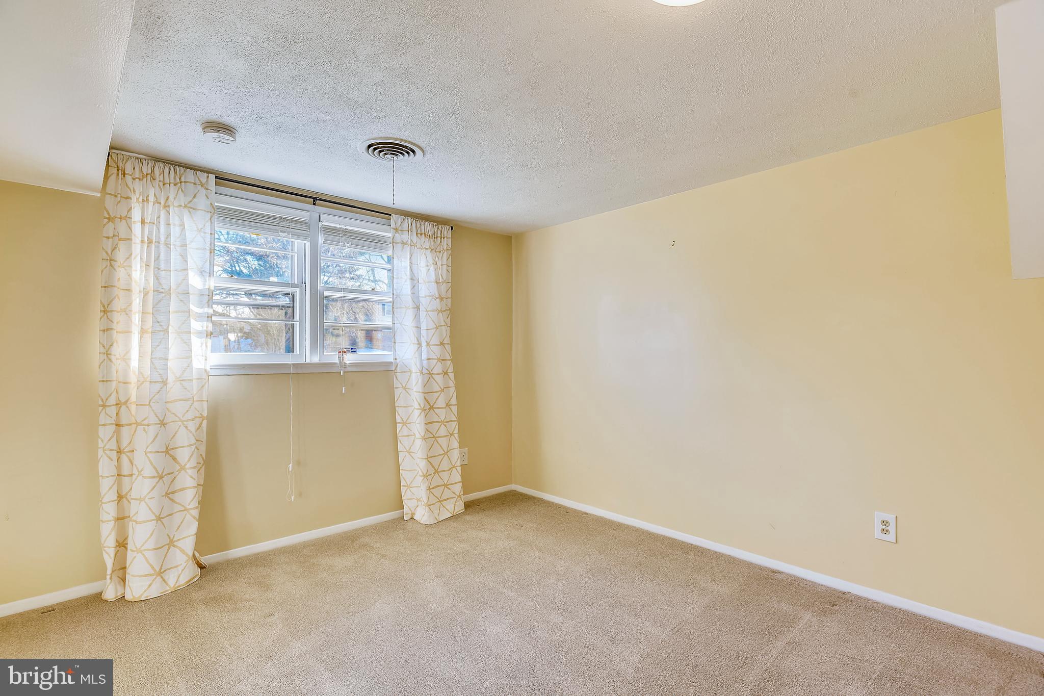 7308 Foxe Place Springfield, VA 22151 - Photo 32 of 38 a view of an empty room with a window