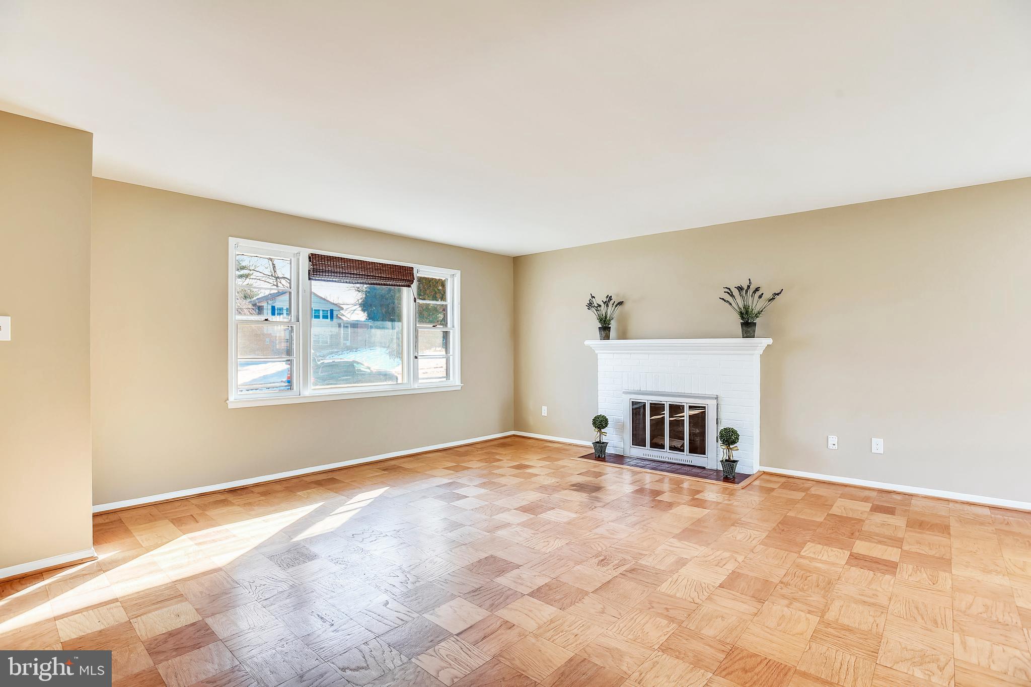 7308 Foxe Place Springfield, VA 22151 - Photo 8 of 38 an empty room with fireplace and windows