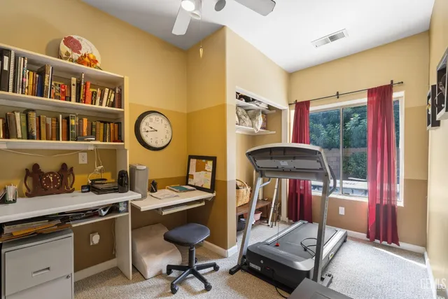 a view of a workspace with furniture