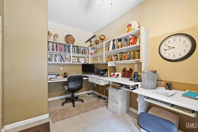 a spacious bedroom with a bed and a chandelier