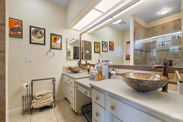 a bathroom with a shower and a sink