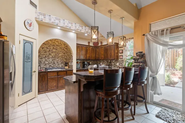a view of dining room and kitchen with a table chairs