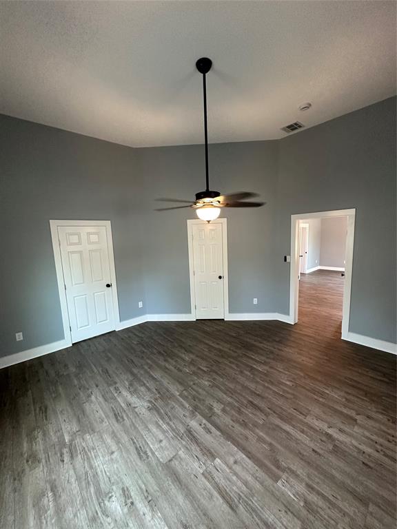 605 South Fordyce Street Blooming Grove, TX 76626 - Photo 18 of 30 a view of an empty room with wooden floor