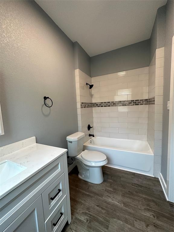 605 South Fordyce Street Blooming Grove, TX 76626 - Photo 19 of 30 a bathroom with a sink a toilet and shower