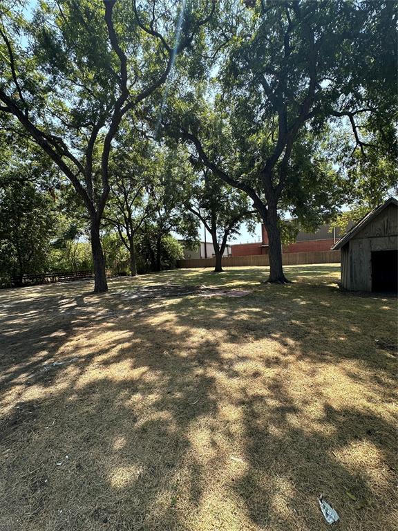 605 South Fordyce Street Blooming Grove, TX 76626 - Photo 29 of 30 a view of a field with a tree