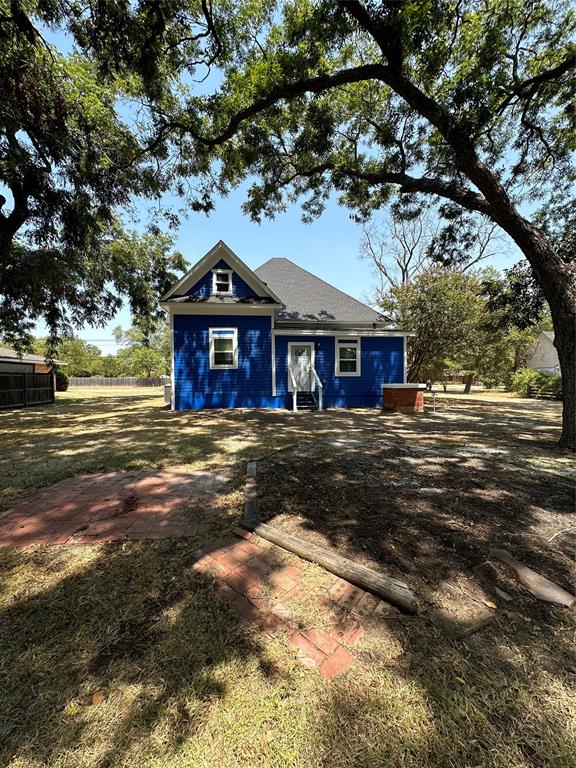 605 South Fordyce Street Blooming Grove, TX 76626 - Photo 30 of 30 a front view of a house with a garden