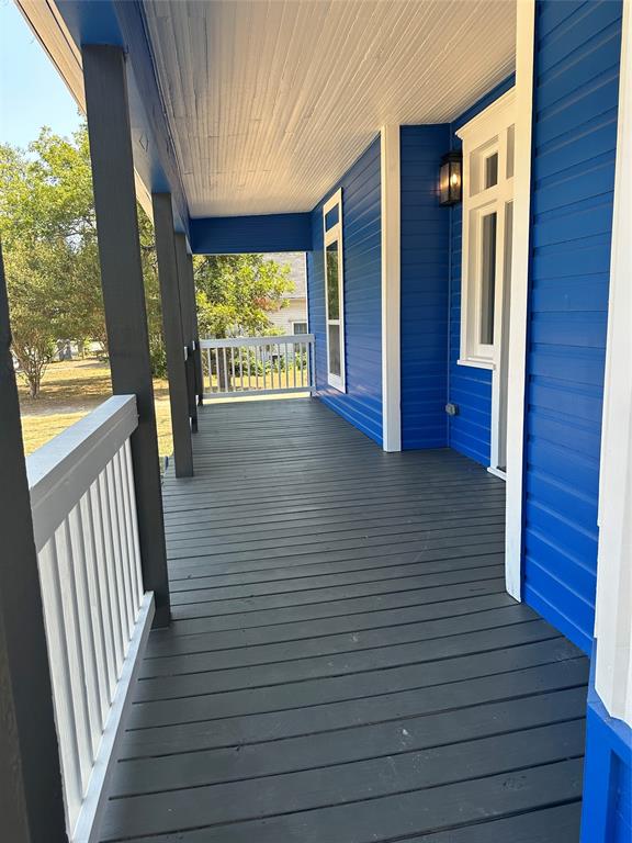 605 South Fordyce Street Blooming Grove, TX 76626 - Photo 3 of 30 a view of balcony and wooden floor