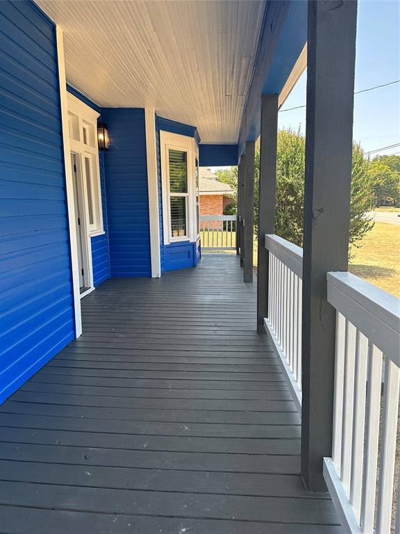 605 South Fordyce Street Blooming Grove, TX 76626 - Photo 4 of 30 a view of a porch with wooden floor and stairs