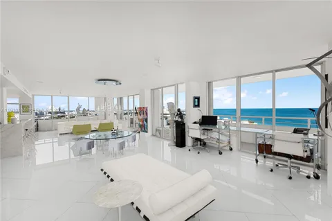 a bedroom with a large bed and a mirror