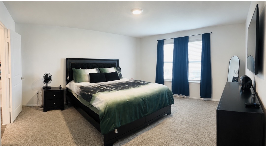 14817 Perlino Way, Unit A Manor, TX 78653 - Photo 18 of 40 a bedroom with a bed and a dresser