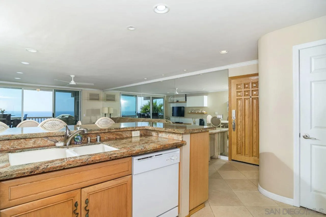 833 Beach Front Drive, Unit C Solana Beach, CA 92075 - Photo 13 of 25 a kitchen with a sink and a refrigerator