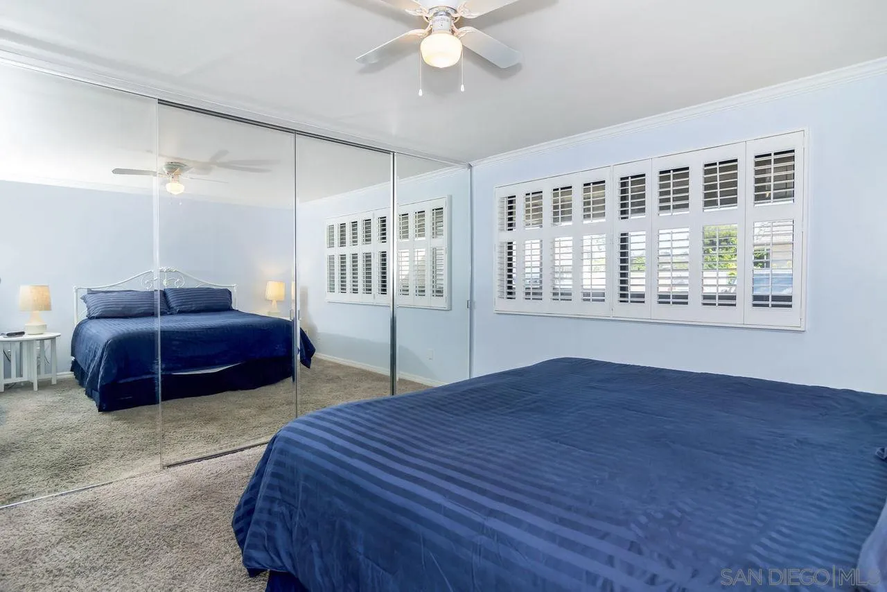 833 Beach Front Drive, Unit C Solana Beach, CA 92075 - Photo 15 of 25 a spacious bedroom with a bed and a large window