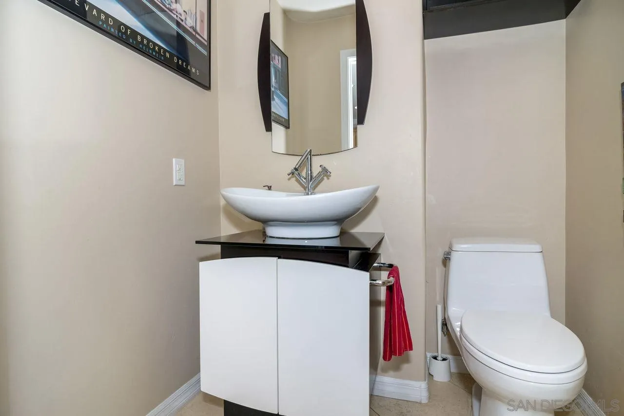 833 Beach Front Drive, Unit C Solana Beach, CA 92075 - Photo 20 of 25 a bathroom with a toilet and a sink