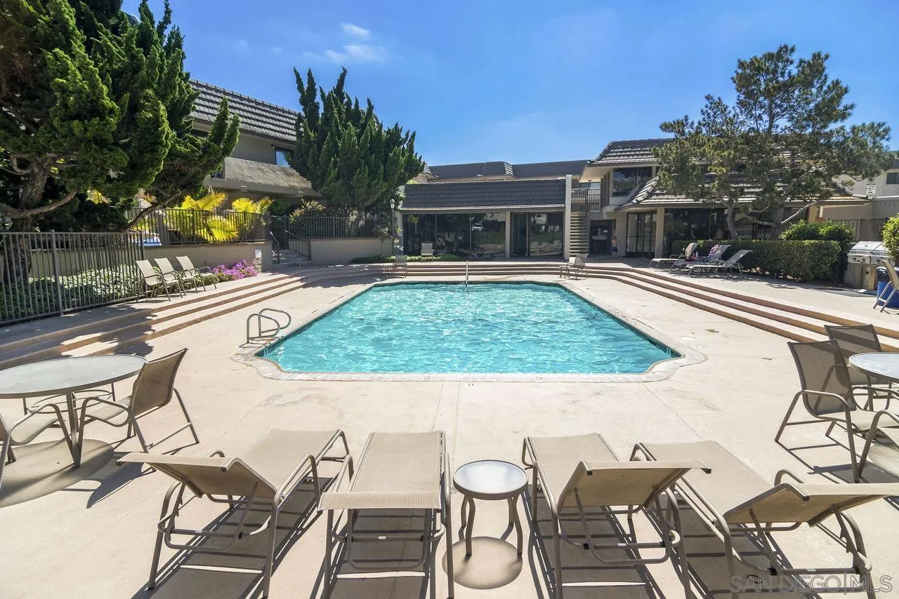 833 Beach Front Drive, Unit C Solana Beach, CA 92075 - Photo 25 of 25 a view of a patio with table and chairs and potted plants