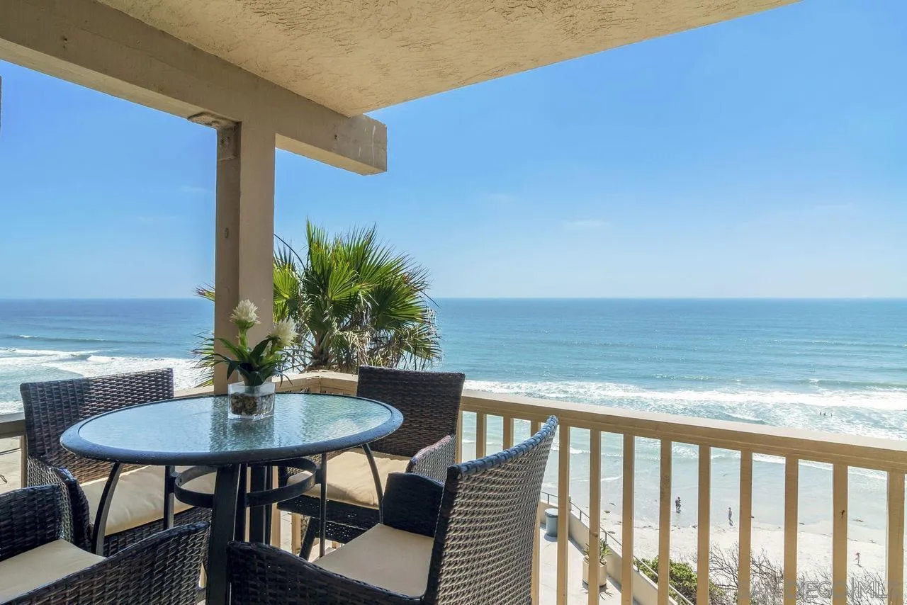 833 Beach Front Drive, Unit C Solana Beach, CA 92075 - Photo 4 of 25 a balcony with wooden floor table and chairs