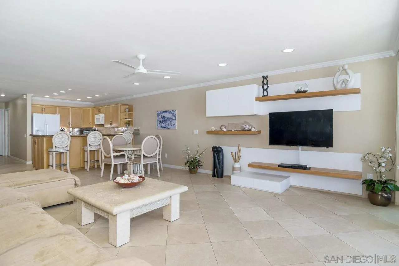 833 Beach Front Drive, Unit C Solana Beach, CA 92075 - Photo 9 of 25 a living room with furniture kitchen and a flat screen tv