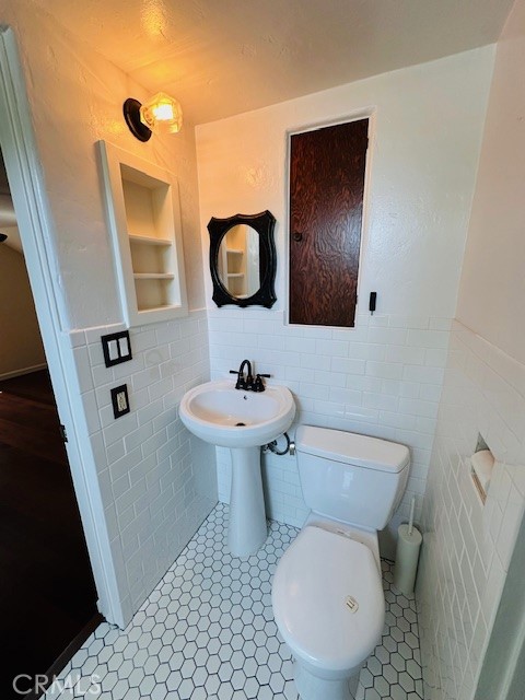 322 South Ohio Street Anaheim, CA 92805 - Photo 24 of 31 a bathroom with a toilet sink and mirror