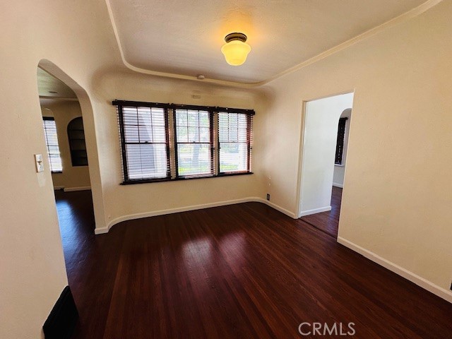 322 South Ohio Street Anaheim, CA 92805 - Photo 8 of 31 an empty room with wooden floor and windows