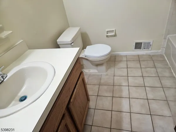a bathroom with a toilet and a bathtub