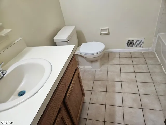 a bathroom with a toilet and a bathtub