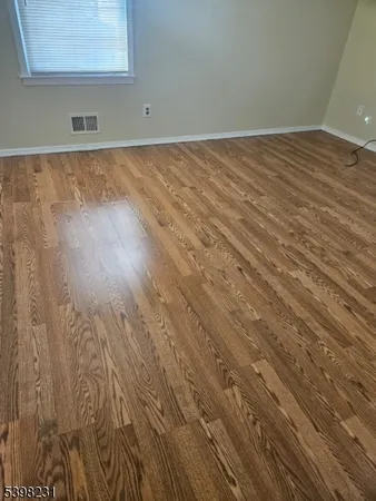 a view of wooden floor in a bathroom