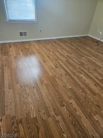 a view of wooden floor in a bathroom