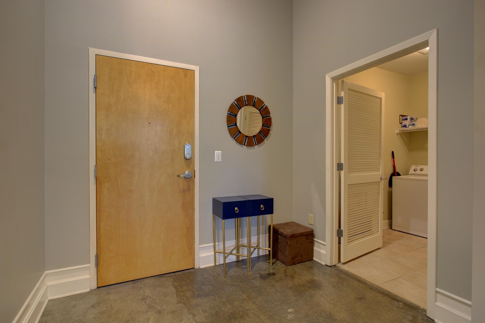 648 Riverside Drive, Unit 219 Memphis, TN 38103 - Photo 20 of 28 Wood-finish entry door with modern hardware