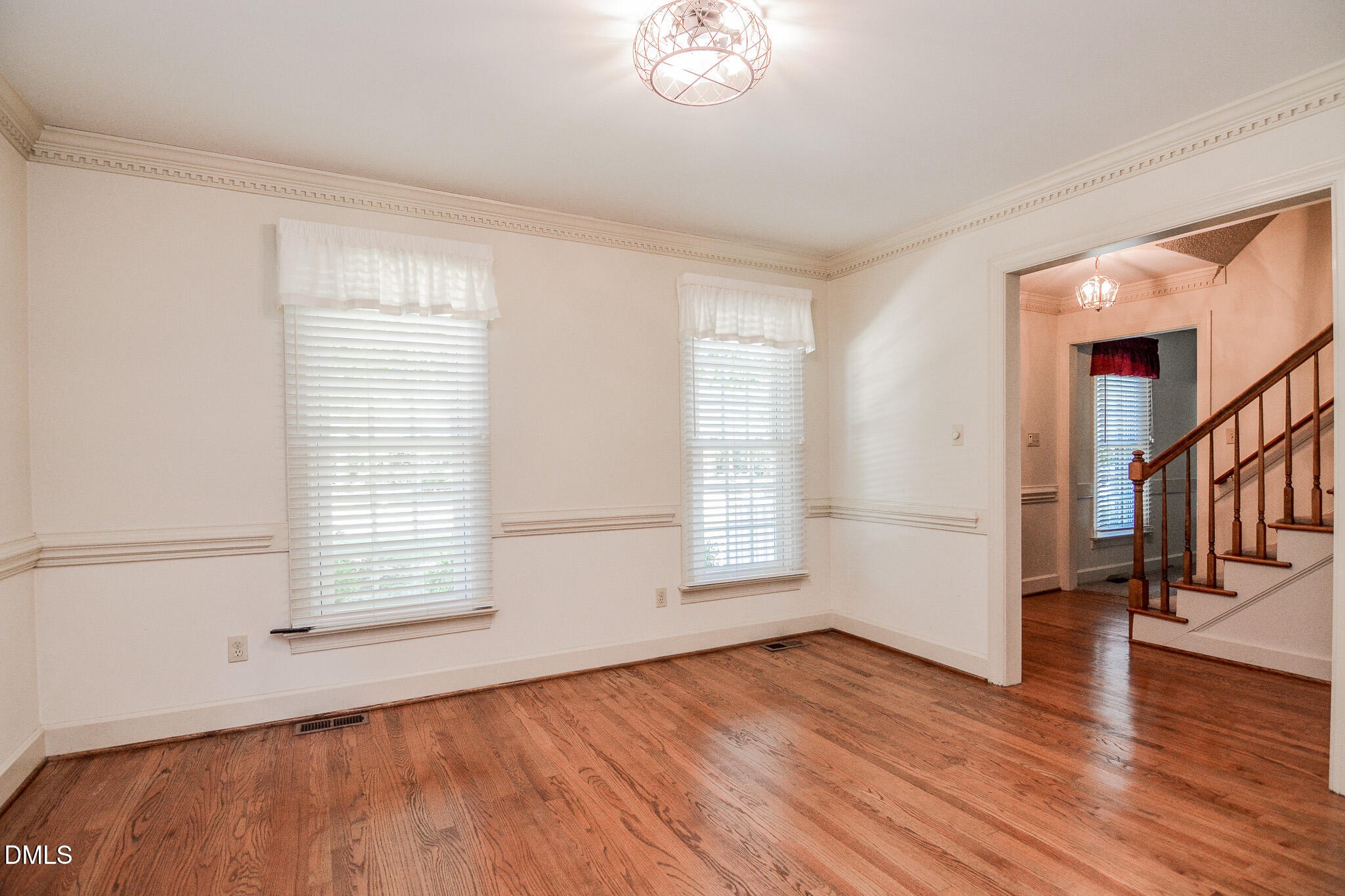 1215 Cambridge Road Northwest Wilson, NC 27896 - Photo 37 of 54 a view of empty room with wooden floor and fan