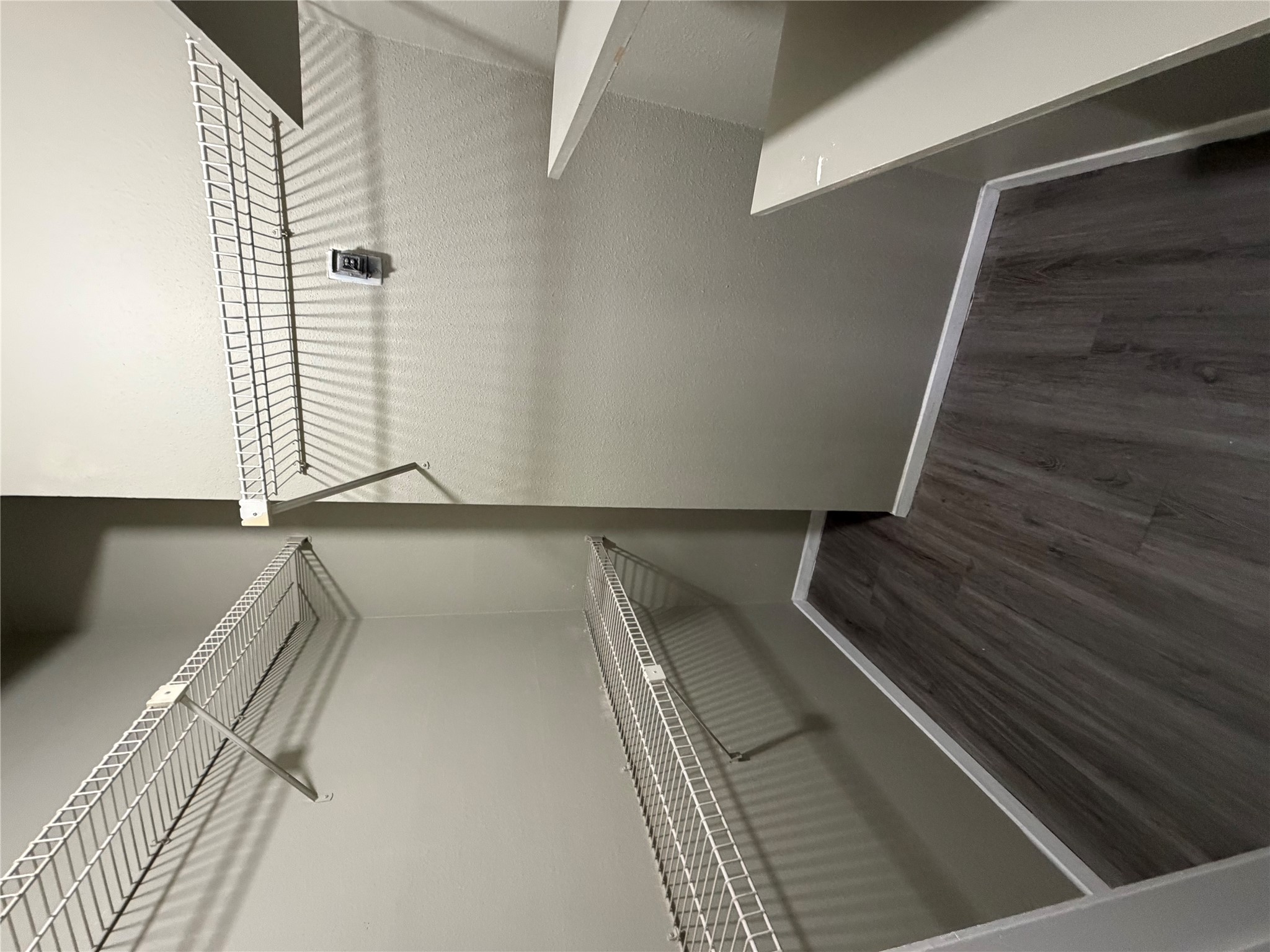 2801 Rio Grande Street, Unit 208 Austin, TX 78705 - Photo 5 of 8 Ample shelving in this well-organized walk-in closet offers convenient storage options.